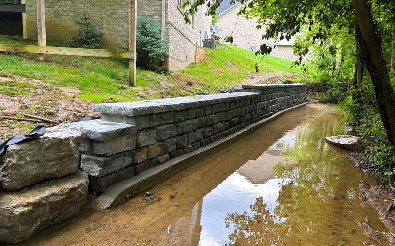 Close view of Novum Wall concrete units and cap pieces