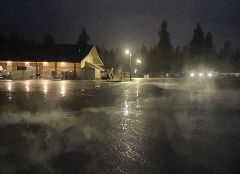 Fresh asphalt during nighttime Treasure State Concrete, Inc. project work