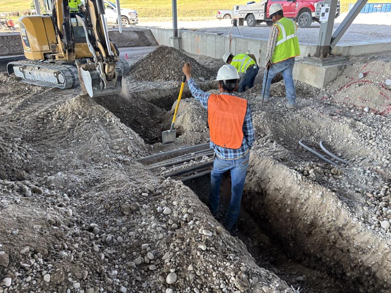 Treasure State Concrete, Inc. crew reviewing groundwork and existing site conditions before construction